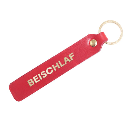 Schlüsselanhänger "Beischlaf" aus Leder mit Charakter