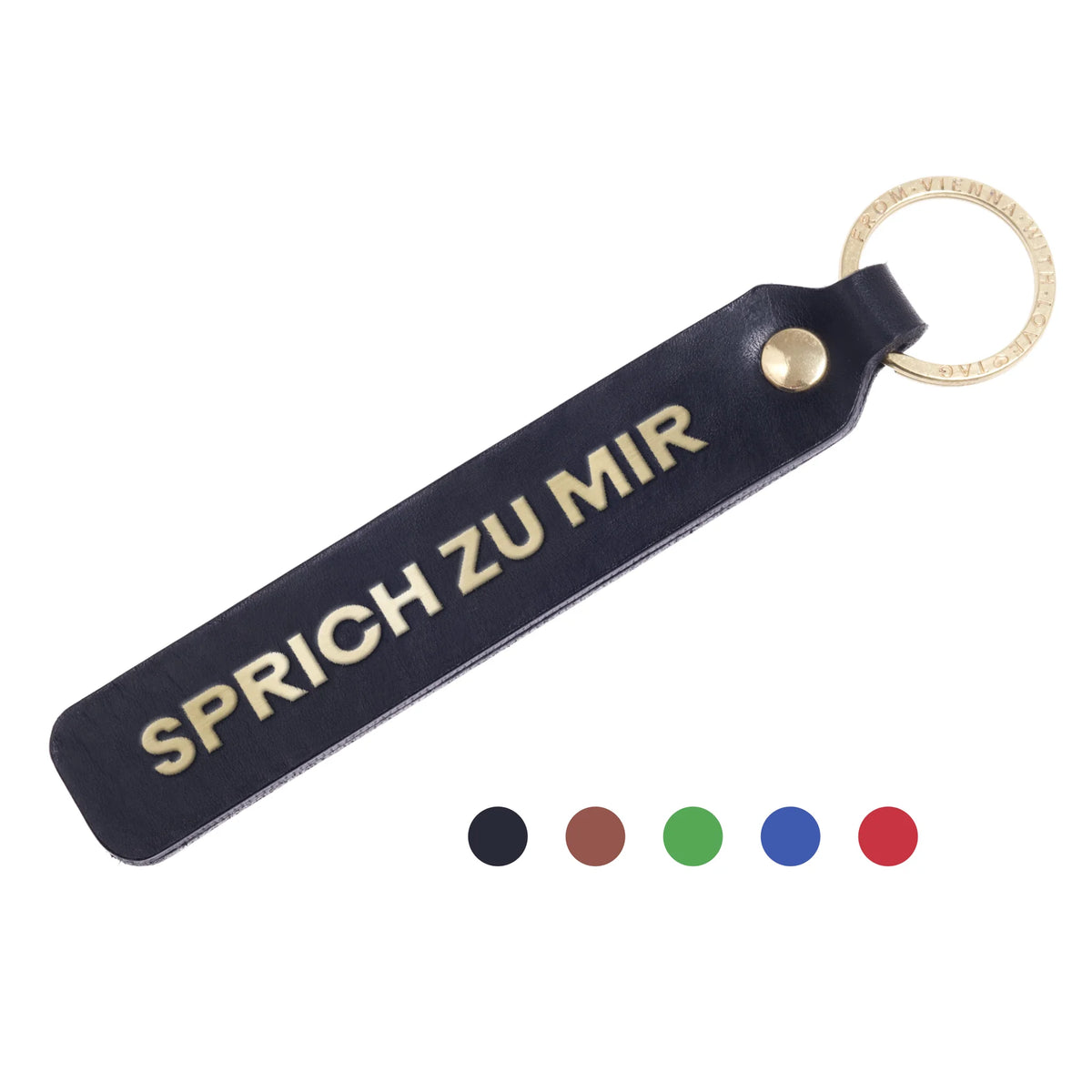 Flatlay, Schlüsselanhänger aus Leder in Schwarz mit Goldprägung 'Sprich Zu Mir' von LoveTag, handgefertigt in Wien